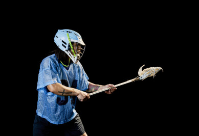 Lacrosse player with stick